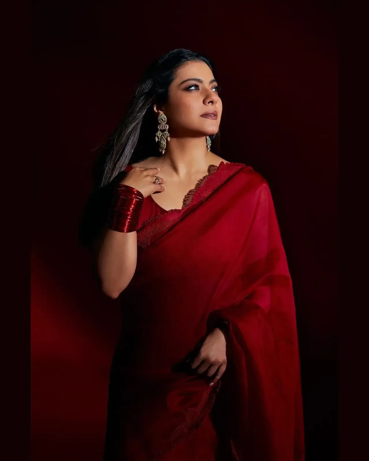 North Indian actress Kajol Devgn in Sleeveless Maroon Color saree